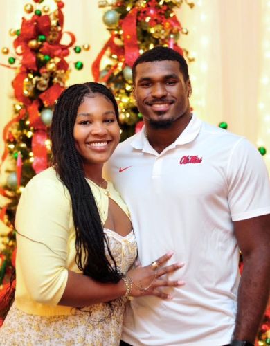 Two white gloves joing hands in dance.