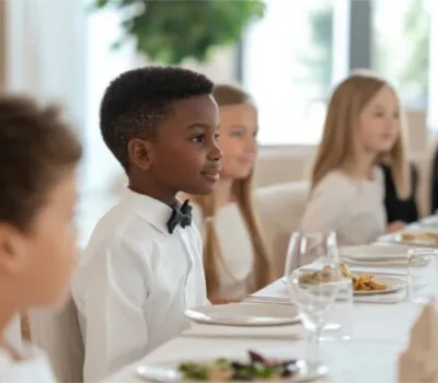 Cotillionstudents sitting at the diner table.